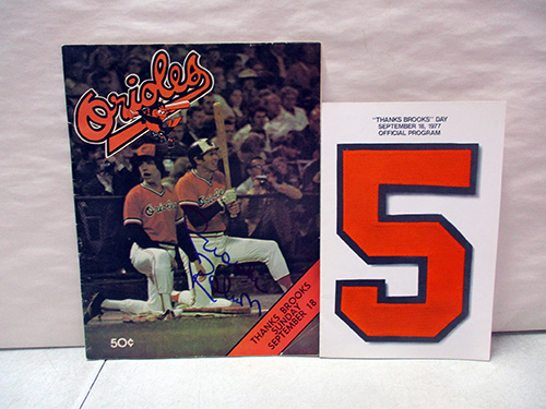 image of 1977 Orioles Program and Brooks Robinson Signed Card